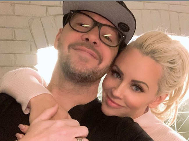 ​The original bill was for $78.46, which Donnie Wahlberg​ (L) rounded off to $2,098 during dinner with wife Jenny McCarthy​ (R).