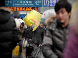 Migrant workers in Shanghai streamed into the city's main train station