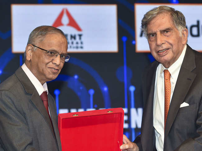 Indian IT industrialist and co-founder of Infosys, N R Narayan Murthy (L) confers the TIE Con Mumbai 2020 lifetime achievement award to Indian industrialist Ratan Tata in Mumbai.