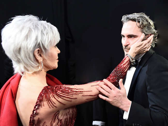 Jane Fonda ​comforts ​Joaquin Phoenix after he receives his Oscar for Best Actor at the 92nd Academy Awards in Hollywood.