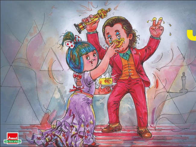 The artwork shows the Amul girl, feeding Amul butter to Joaquin Phoenix who is dressed as Joker.