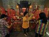 Indonesian Chinese pray at a temple in Jakarta