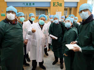 Experts from China and the World Health Organization (WHO) joint team wearing face masks visit the Wuhan Tongji Hospital in Wuhan Reuters