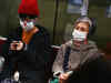 WHO warns of pandemic risk after virus peaks in China