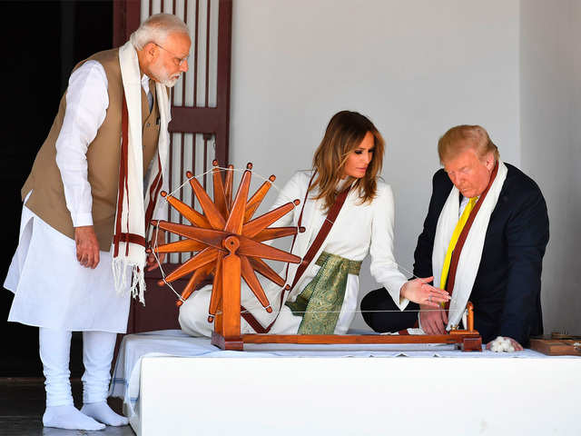 Donald, Melania Trump next to a charkha