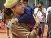 At Yogi's event: Cop on duty with infant son in her arms