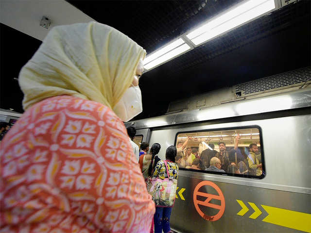 ​A commuter wearing a protective mask