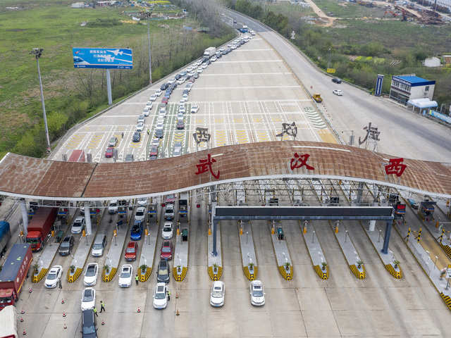 ​Vehicles crossing toll station in Wuhan