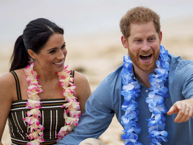 Prince Harry (R) might have to give up hunting​ soon for his wife Meghan (L).​