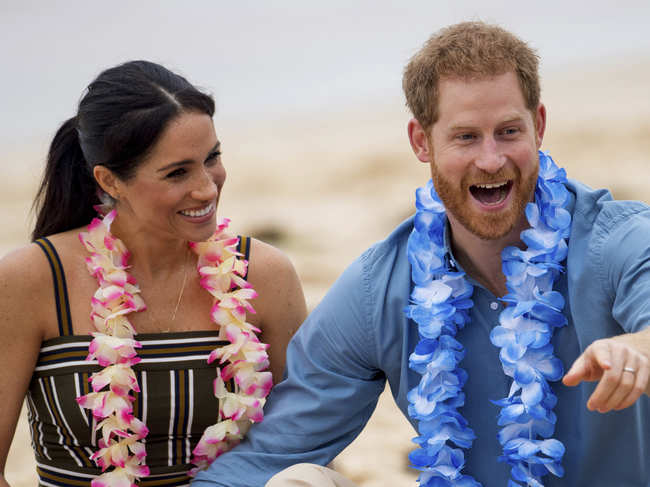 Prince Harry (R) might have to give up hunting? soon for his wife Meghan (L).?