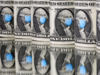 Dollar wobbles as fresh hopes for virus treatment prop up risk appetite