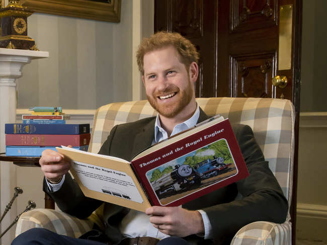 ​In his introduction - which was recorded in January before his move overseas - Prince Harry is seen sitting in an armchair, reading from a book about the train's adventures. ​