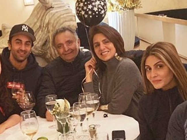 According to some reports, Riddhima Kapoor will travel by road to attend her father's last rites, and be by her mother Neetu Singh (2nd R) and brother Ranbir Kapoor's (L) side.