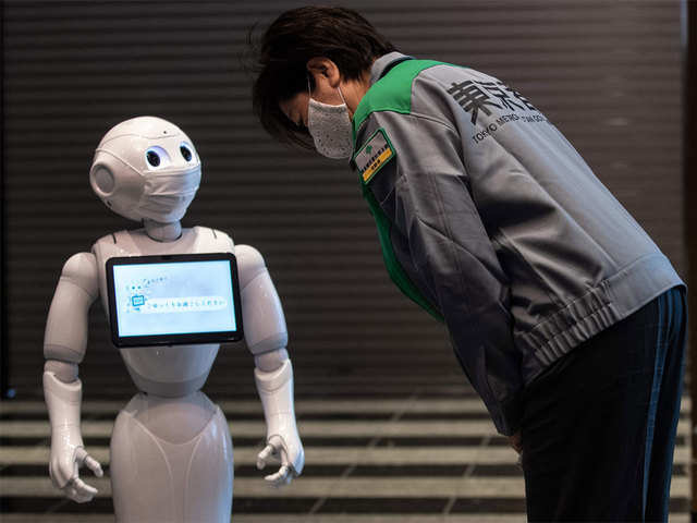 Robot staff greet Tokyo governor