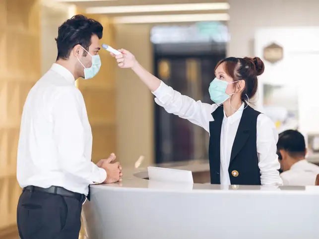 The accuracy of infrared thermometers can be thrown off by headbands or bandannas that make a person too hot.