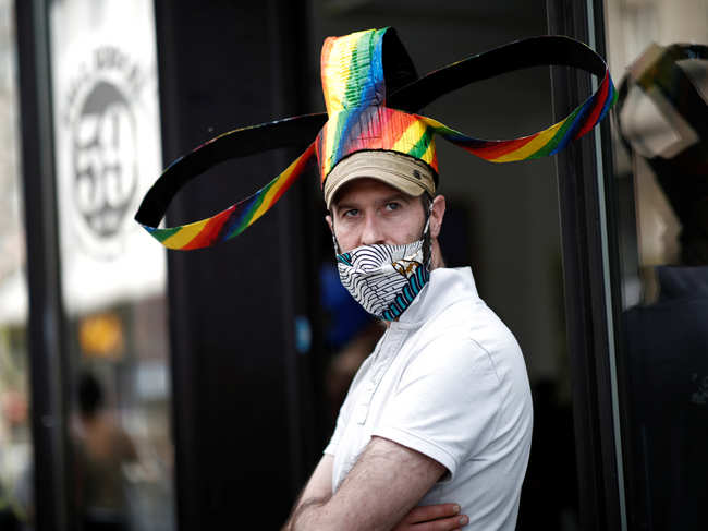 In the time of coronavirus, the owner of a Parisian art gallery has designed special headgear.