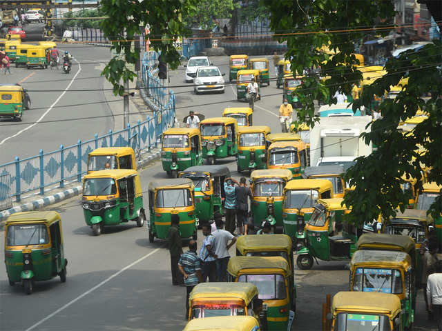​Rickshaw drivers wait for customers