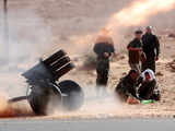 Rebels fire rockets on pro-Gadhafi fighters in Libya