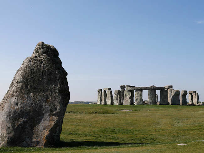 Stonehenge, a huge monument built between 3000 B C and 1600 B C, is one of Britain's most popular tourist attractions.