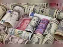 FILE PHOTO: Euro, Hong Kong dollar, U.S. dollar, Japanese yen, British pound and Chinese 100-yuan banknotes are seen in a picture illustration