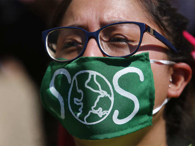Green mask with slogan to create awareness about climate change