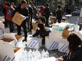 Volunteers pack boxes of supplies