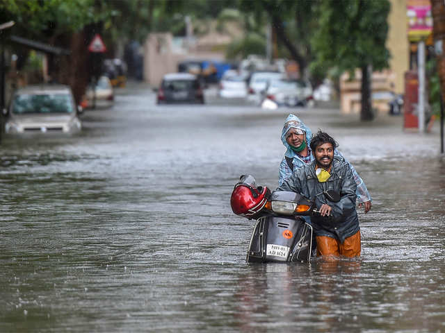 ​Commuters in a waterlogged street
