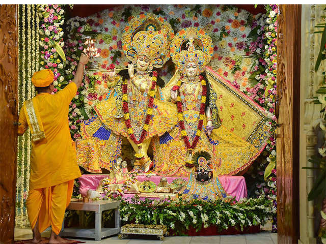 A priest performs 'aarti' of Radha - Krishna at Sri Krishna Janmabhoomi temple on the occasion of Sri Krishna Janmashtami