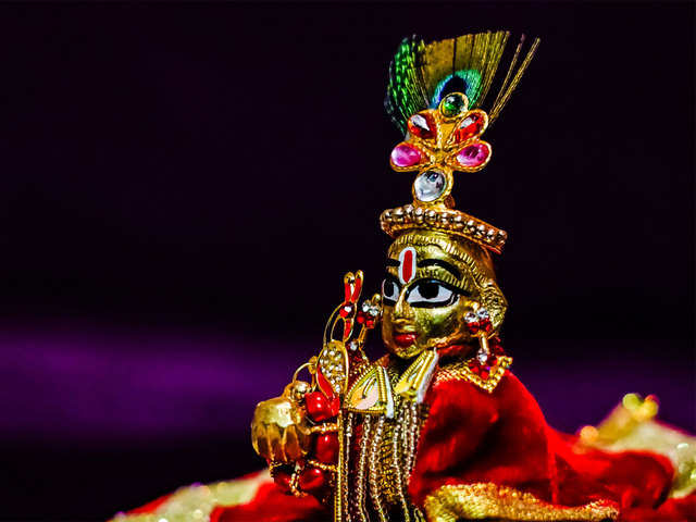 A priest offers prayers at ISKCON Temple on the occasion of Krishna Janmashtami festival.