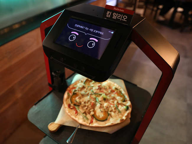 AI serving robot delivers meal during a demonstration at a restaurant on September 15, 2020 in Seoul, South Korea. Korea Telecom (KT) launched a serving robot for restaurants that it says will lessen staff workload and reduce human-to-human contact in light of the coronavirus pandemic.