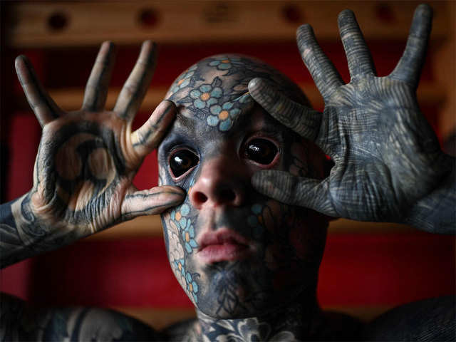 Reptile man tattoo