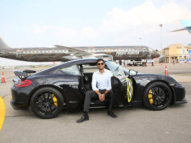 Anindith Reddy poses with his Porsche GT4