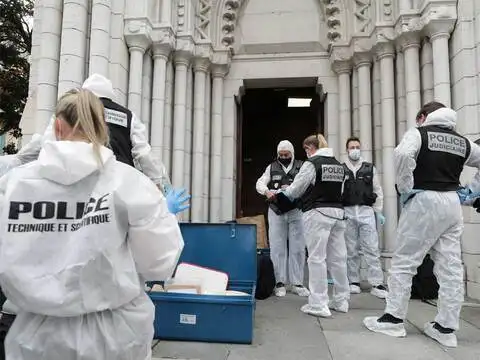 ​Forensic experts work