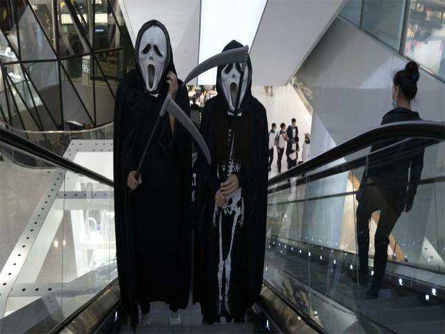​Workers at a shopping mall in Beijing
