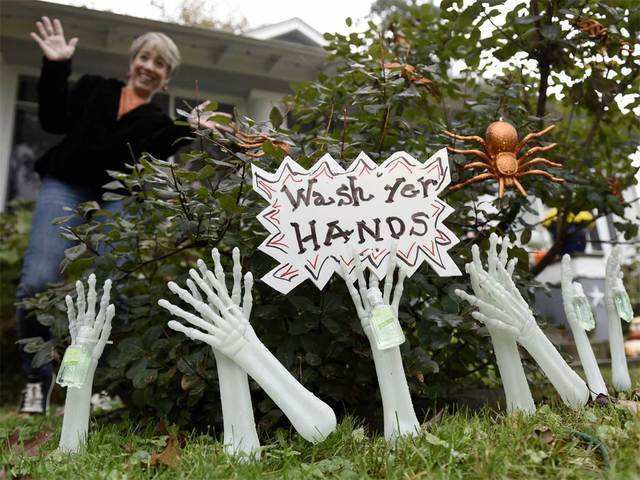 Halloween decorations holding hand sanitizer