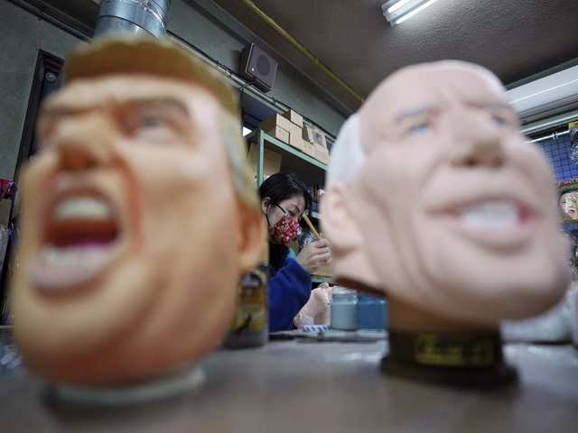 Workers of Ogawa Studios Co. are making rubber face masks of