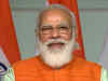 Prime Minister Narendra Modi greets people on Dhanteras