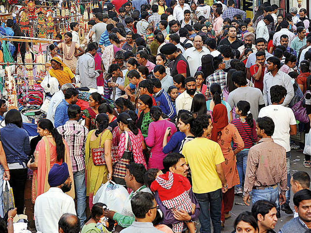 Shoppers throng a Delhi market before Diwali