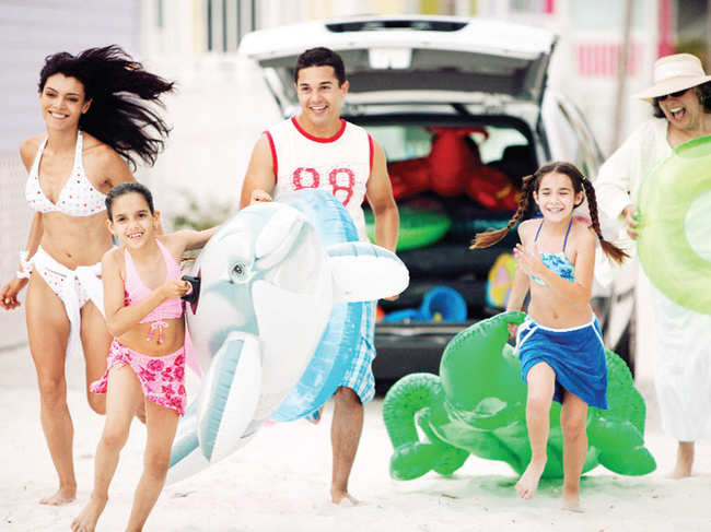 ON WHITE SANDS: Think sarongs, beach volleyball and sand castles for your family vacation