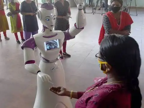 ​Robot gives sanitizer to voters