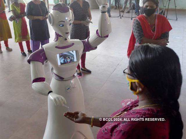 ​Robot gives sanitizer to voters