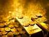 Gold jumps 1% on dollar slide, US stimulus progress