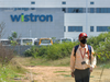 Wistron says it has settled pending payments and is telephoning employees for confirmation