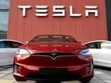 Tesla shares tumble on first day in S&P
