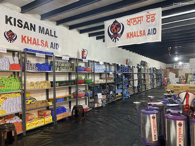 Khalsa Aid sets up Kisan Mall at Tikri border to provide free items to  protesting farmers - Kisan Mall | The Economic Times