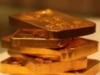 Gold gains on weak dollar as focus turns to Georgia run-offs