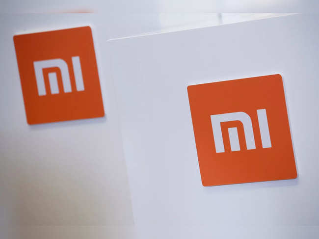 FILE PHOTO: Xiaomi logos are displayed during a news conference in Hong Kong