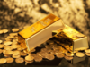 Gold firms on weaker dollar as investors await Yellen's speech