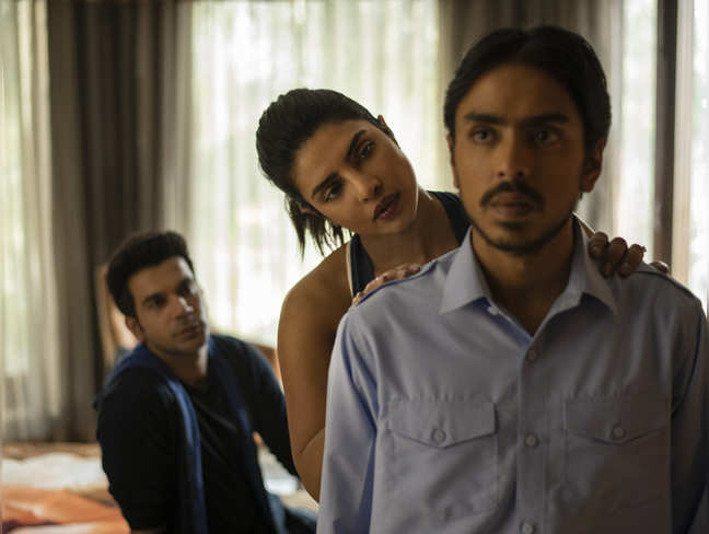 This image released by Netflix shows ​Rajkummar Rao, from left, Priyanka Chopra and Adarsh Gourav ​in a scene from "The White Tiger." (Tejinder Singh Khamkha​/Netflix via AP)
