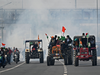 Tear gas shells fired at farmers trying to break barriers with tractors at Delhi's Mukarba Chowk